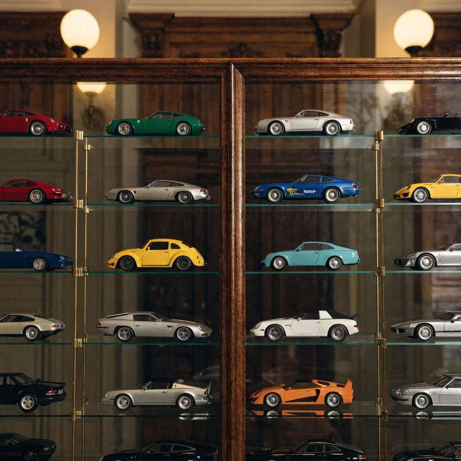 Close-up of Detolf glass shelves with model cars neatly arranged