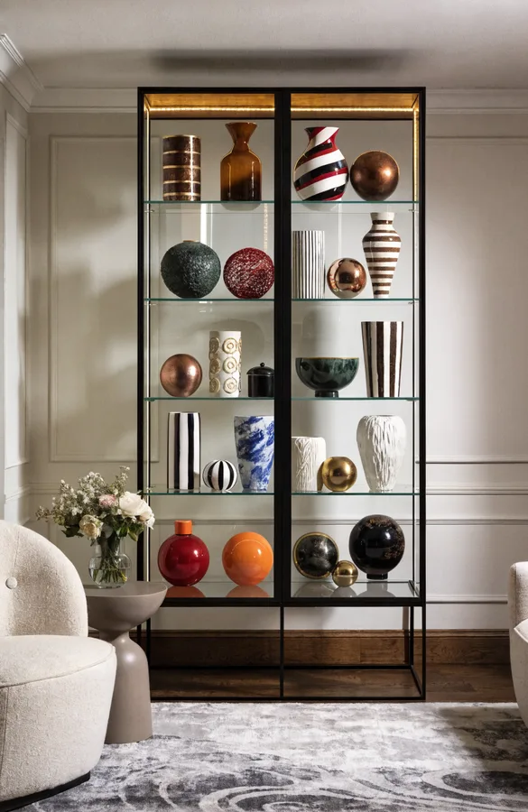 Detolf glass display cabinet showcasing collectible figures with LED lighting